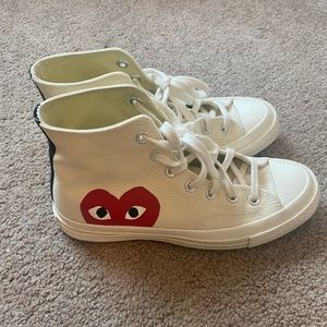 Lightly used white converse, size 8 in women.